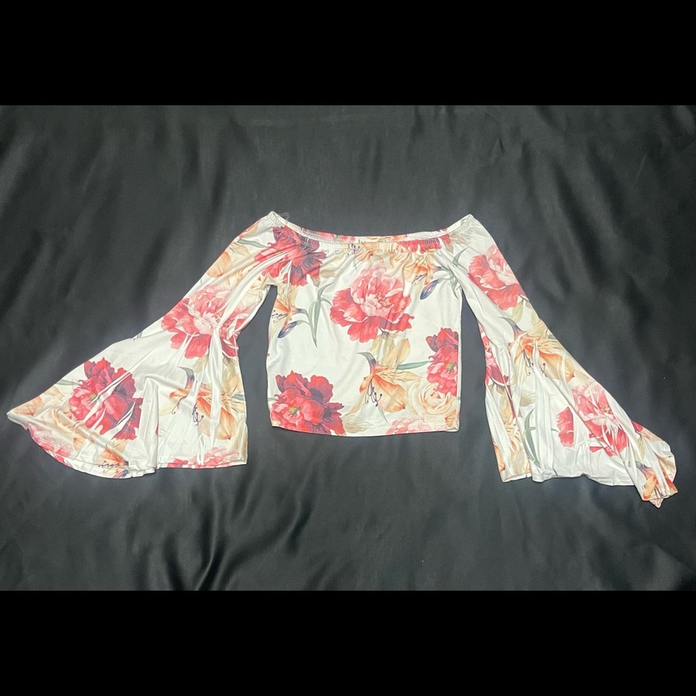 Floral Orr shoulder top with flair sleeve